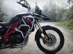 On her bike's f800gs skid plate by outback motortek
